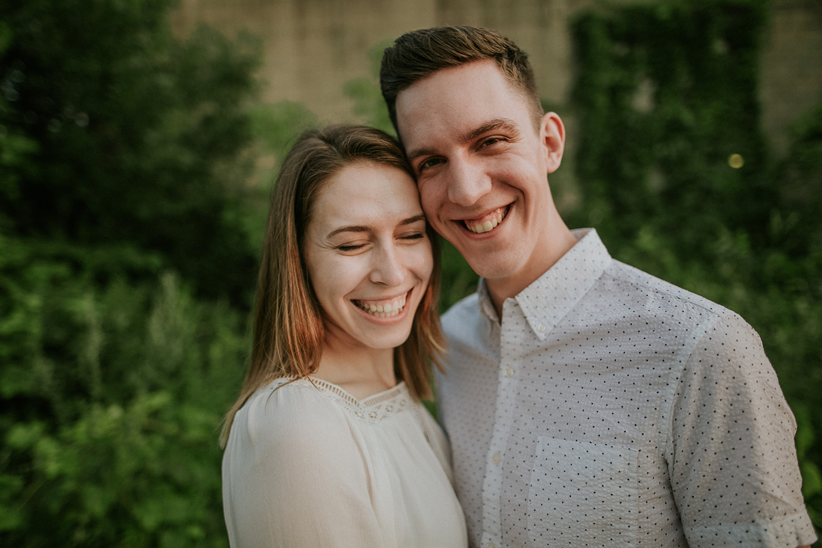 couple embraces during their engagement session in milwaukee