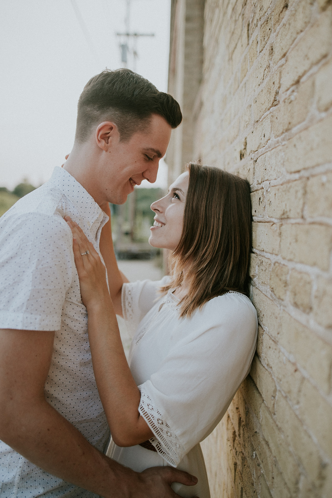 couple embraces during their engagement session in milwaukee