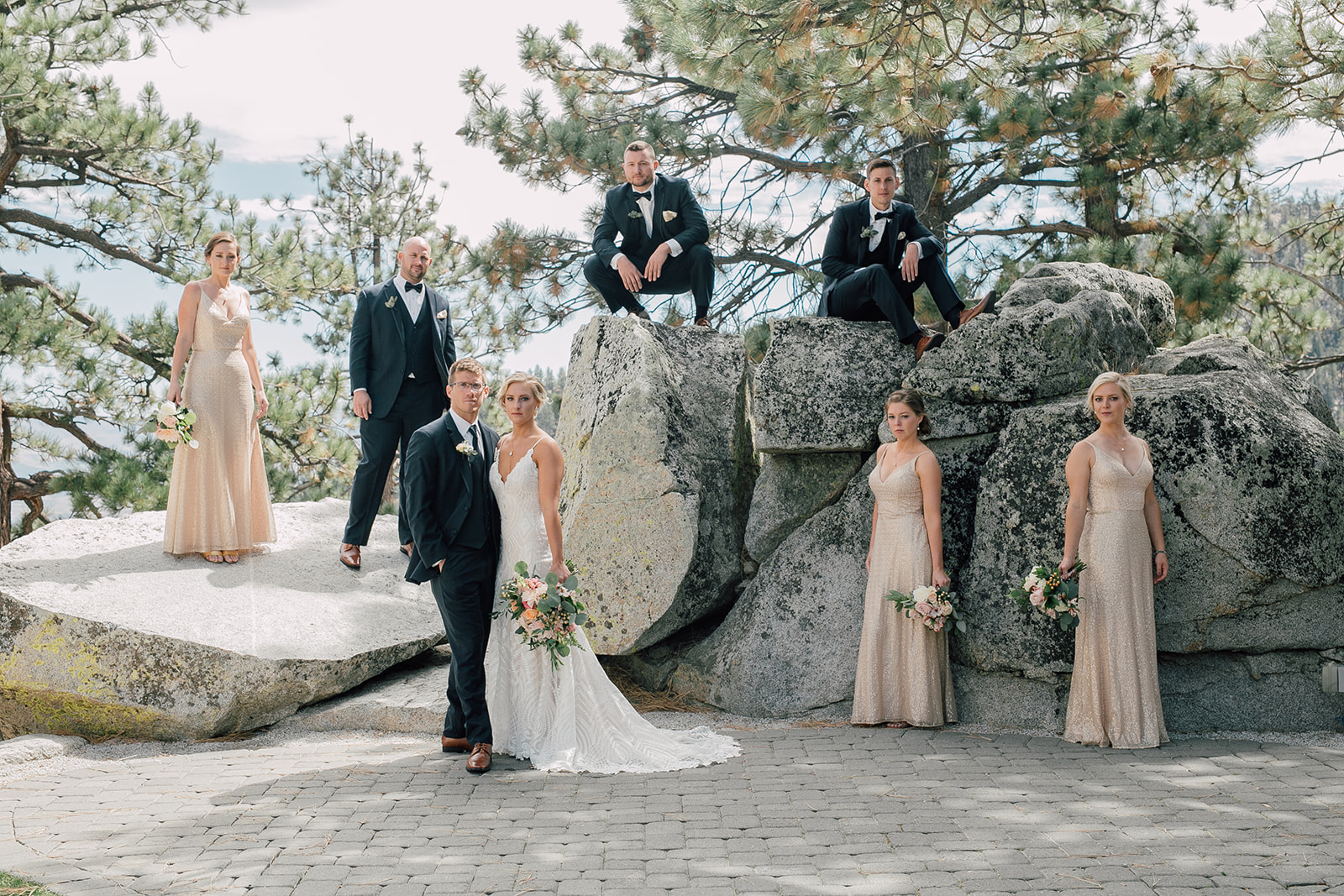 Couple poses with their wedding party on their wedding day in Lake Tahoe