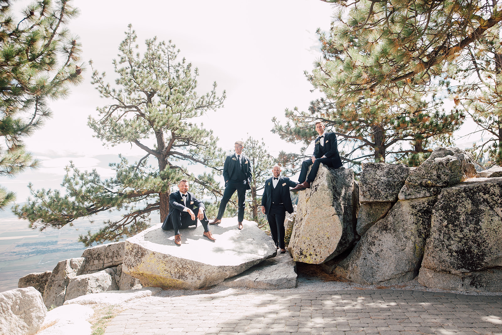 Couple poses with their wedding party on their wedding day in Lake Tahoe