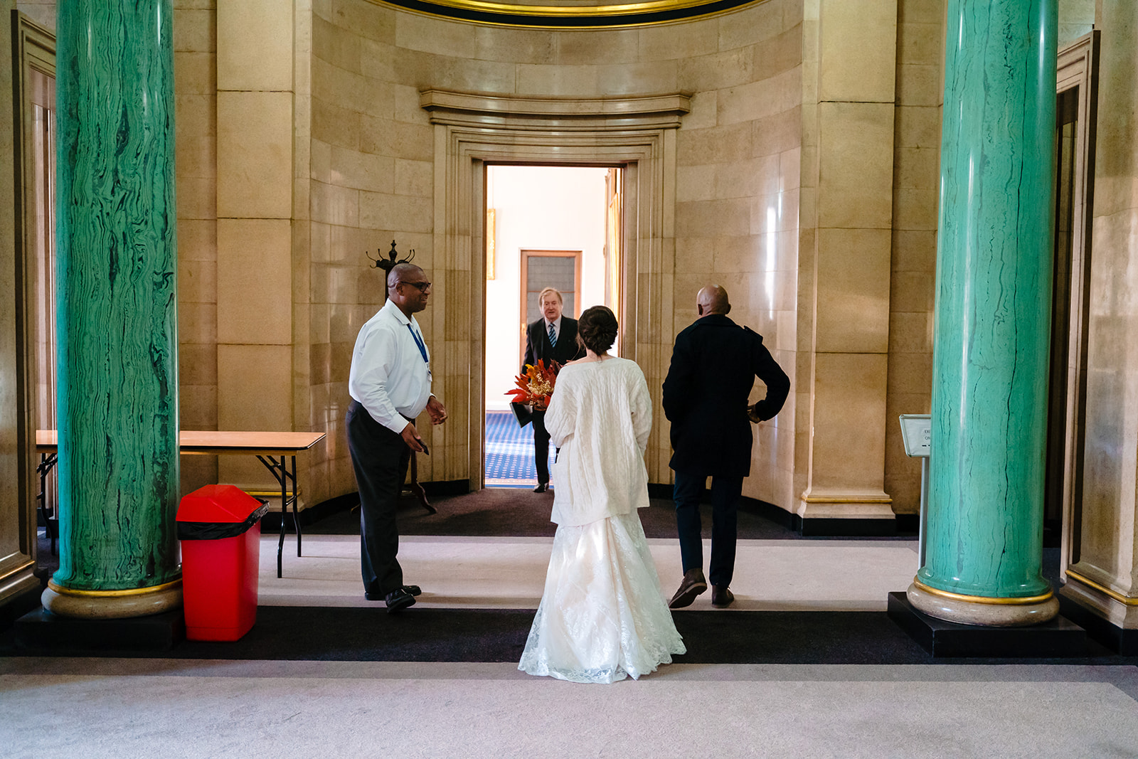 husband and wife walk in to wedding suite at  leeds civic hall