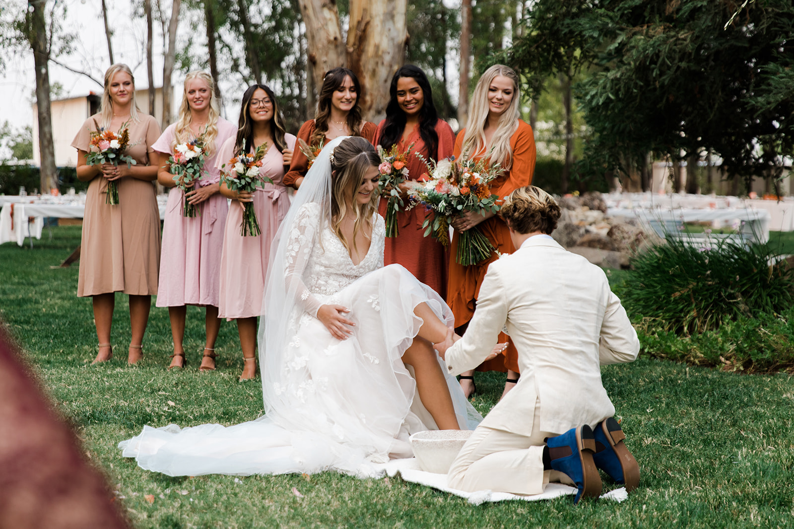 bride and groom have an intimate foot washing during ceremony