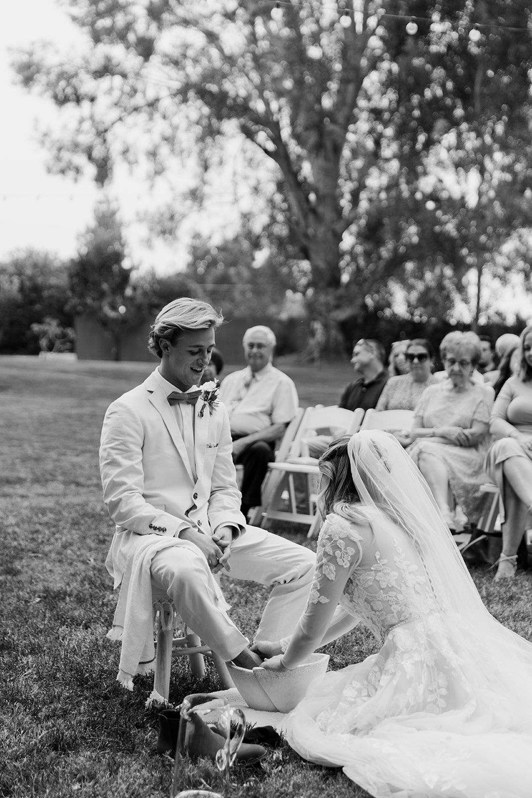 bride and groom have an intimate foot washing during ceremony