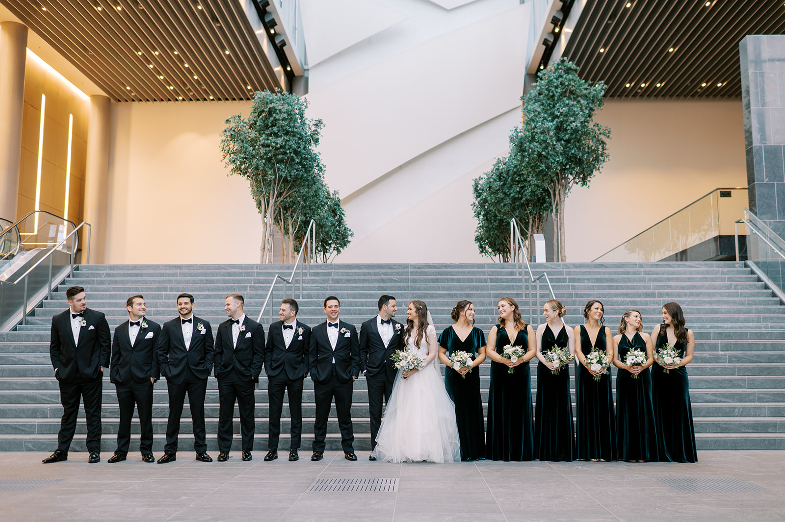 bridal party on stairs at founders hall in charlotte
