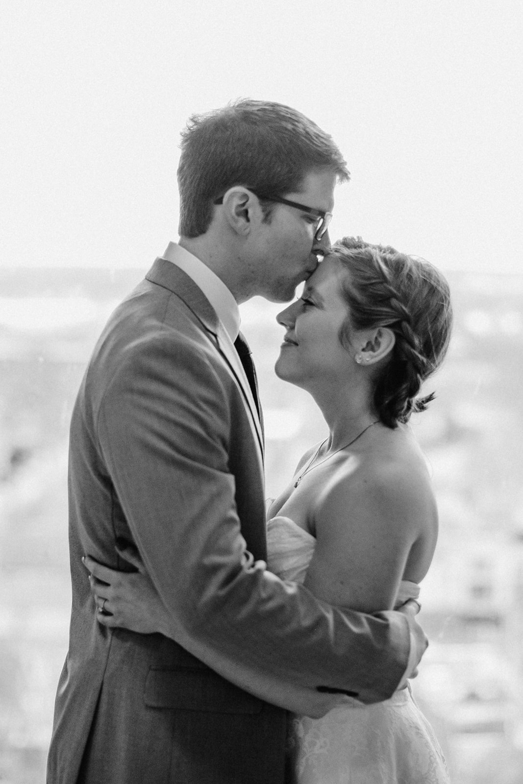 couple kisses before their intimate courthouse elopement in madison wisconsin