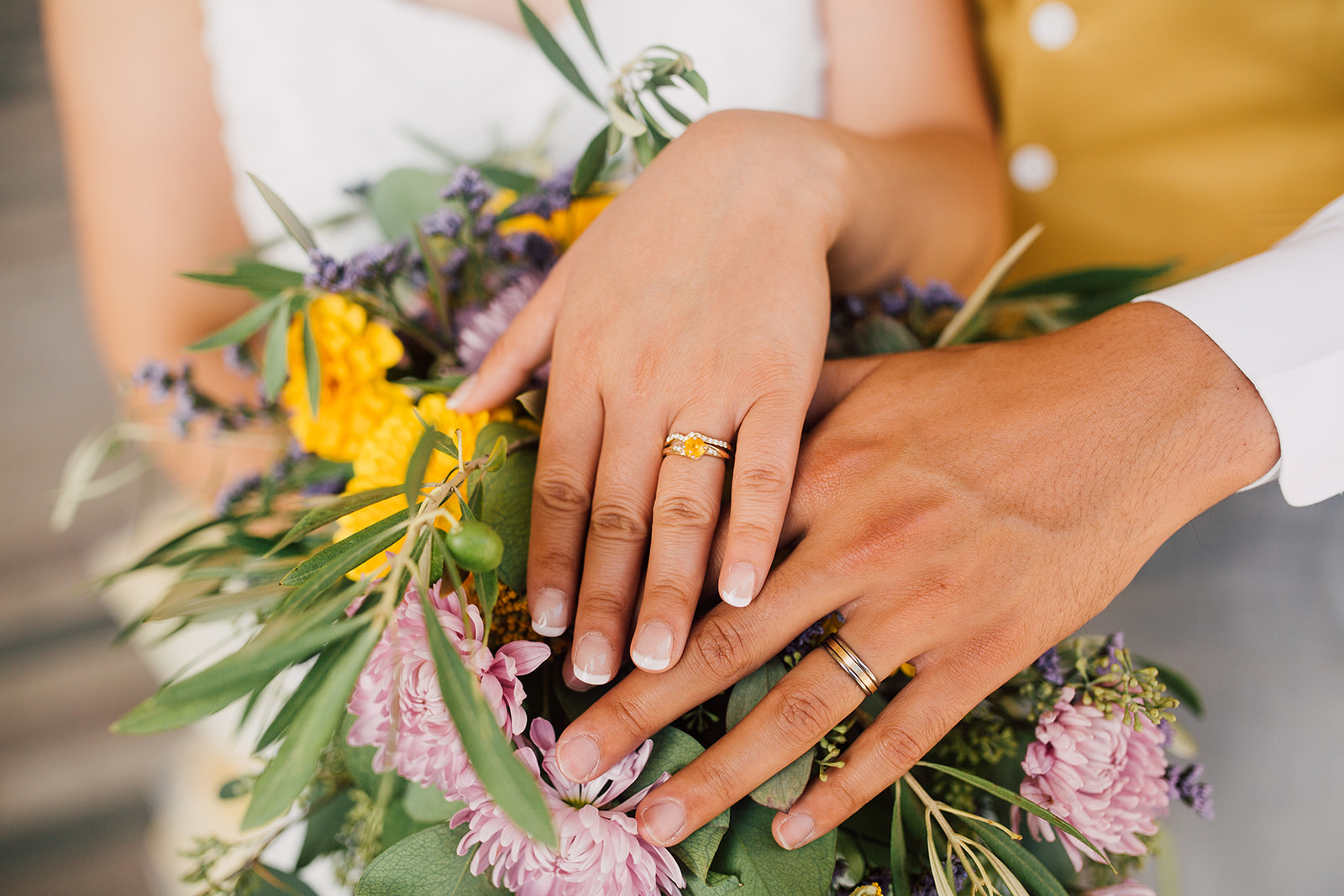 couple shows off their rings after their wedding in madison, wisconsin