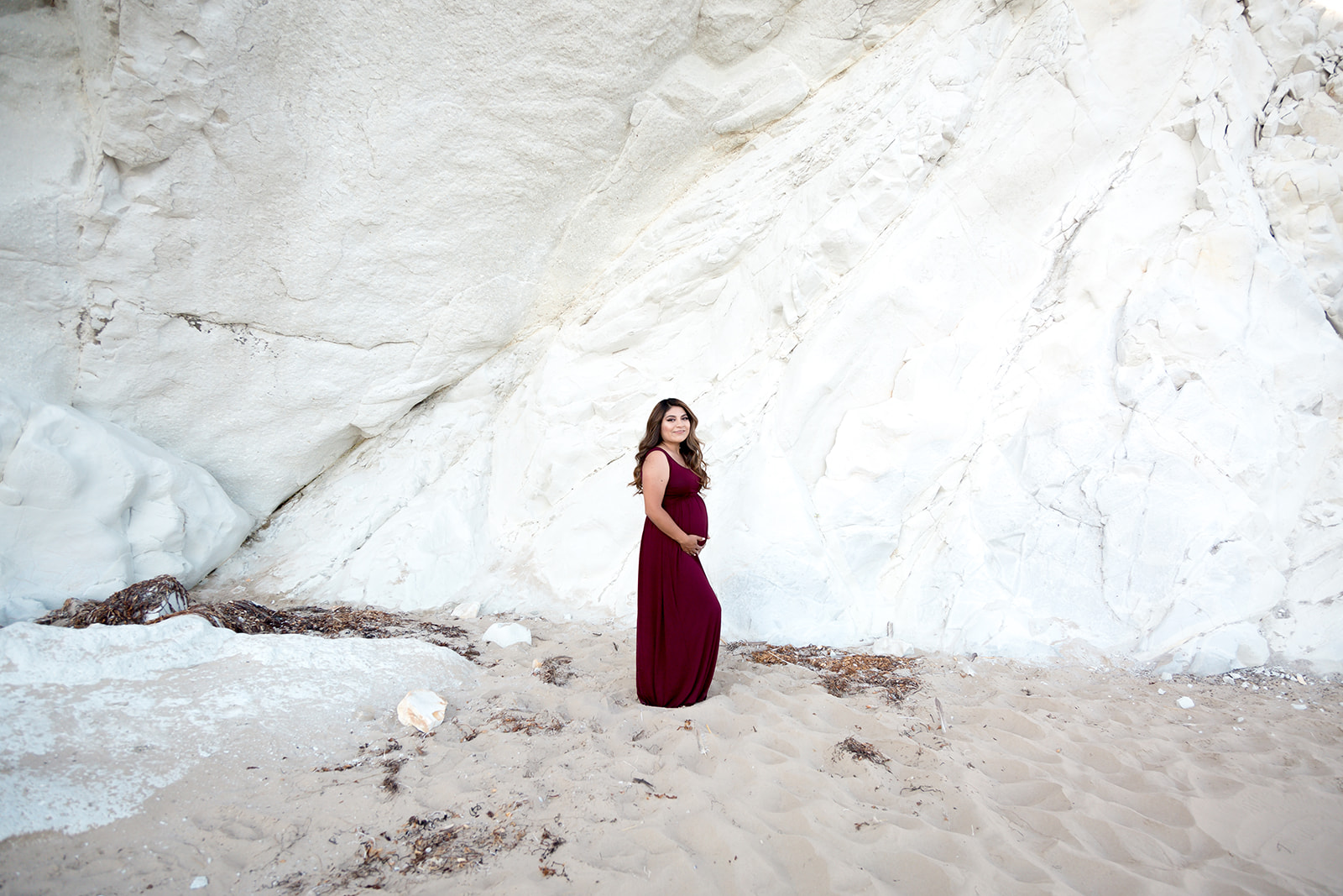 Pismo Beach maternity session in maroon maternity dress at the beach