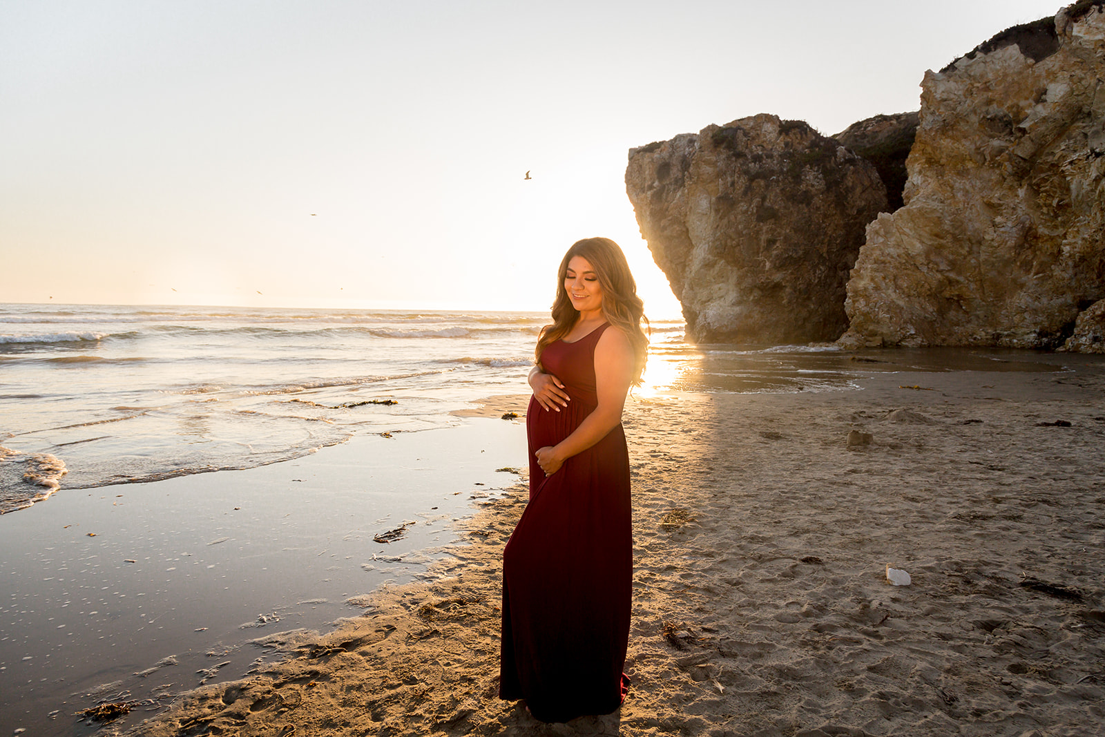 sunflare at pismo beach maternity photoshoot