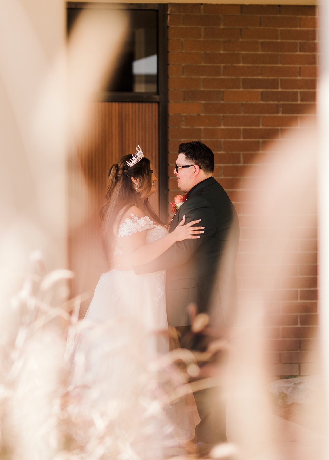 a small personal moment after being married at Saint Angela Merici Catholic Church