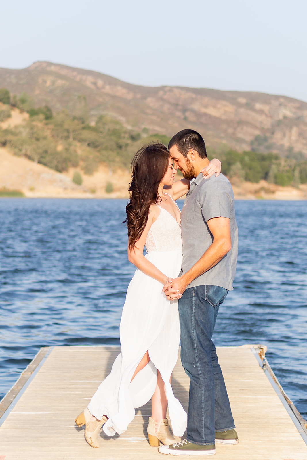 couple standing on the dock in santa margarita lake area