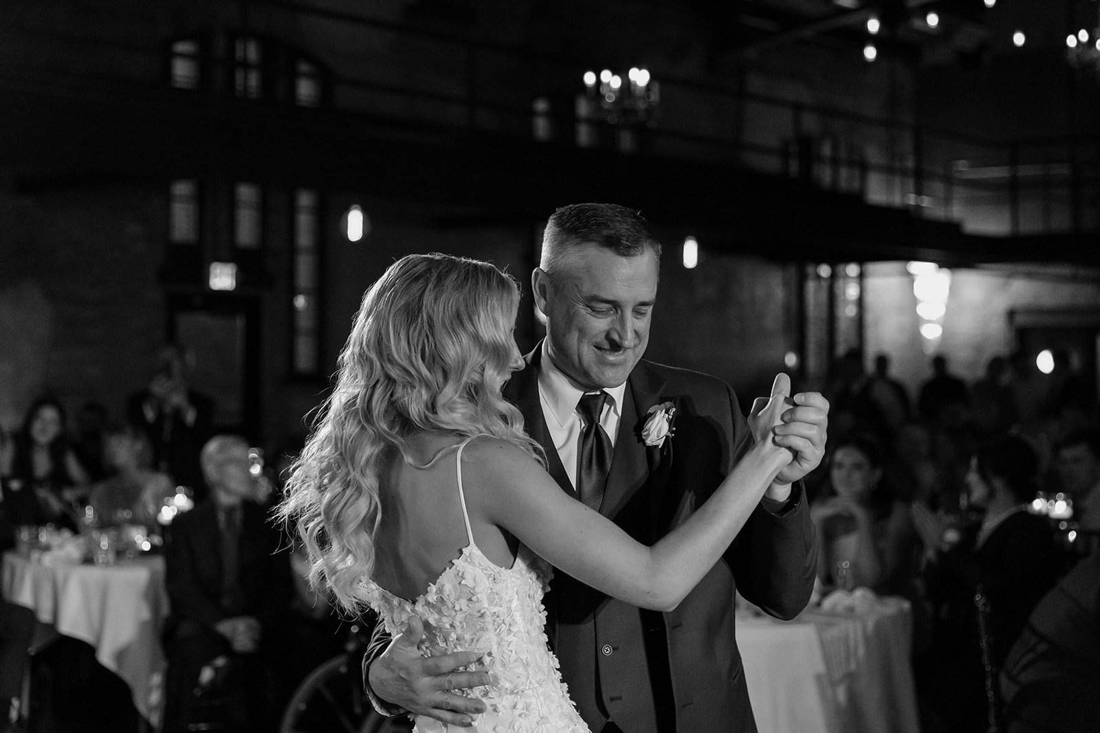 Bride dances with her new father in law.