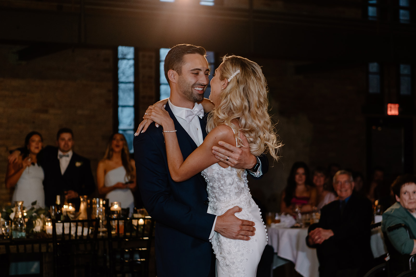 Bride and groom dance on the dance floor at their wedding venue.