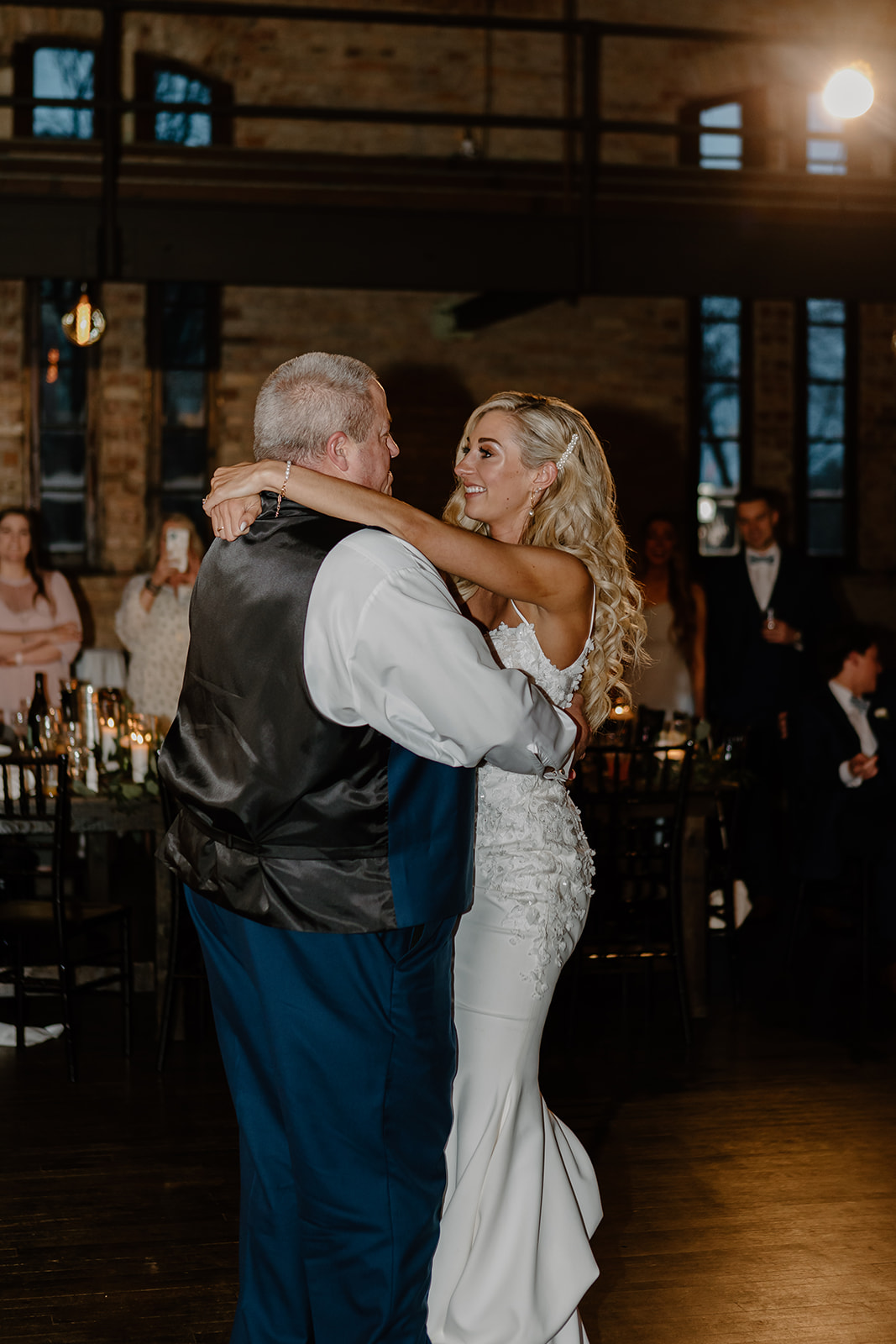 Bride shares her first dance with her father. 