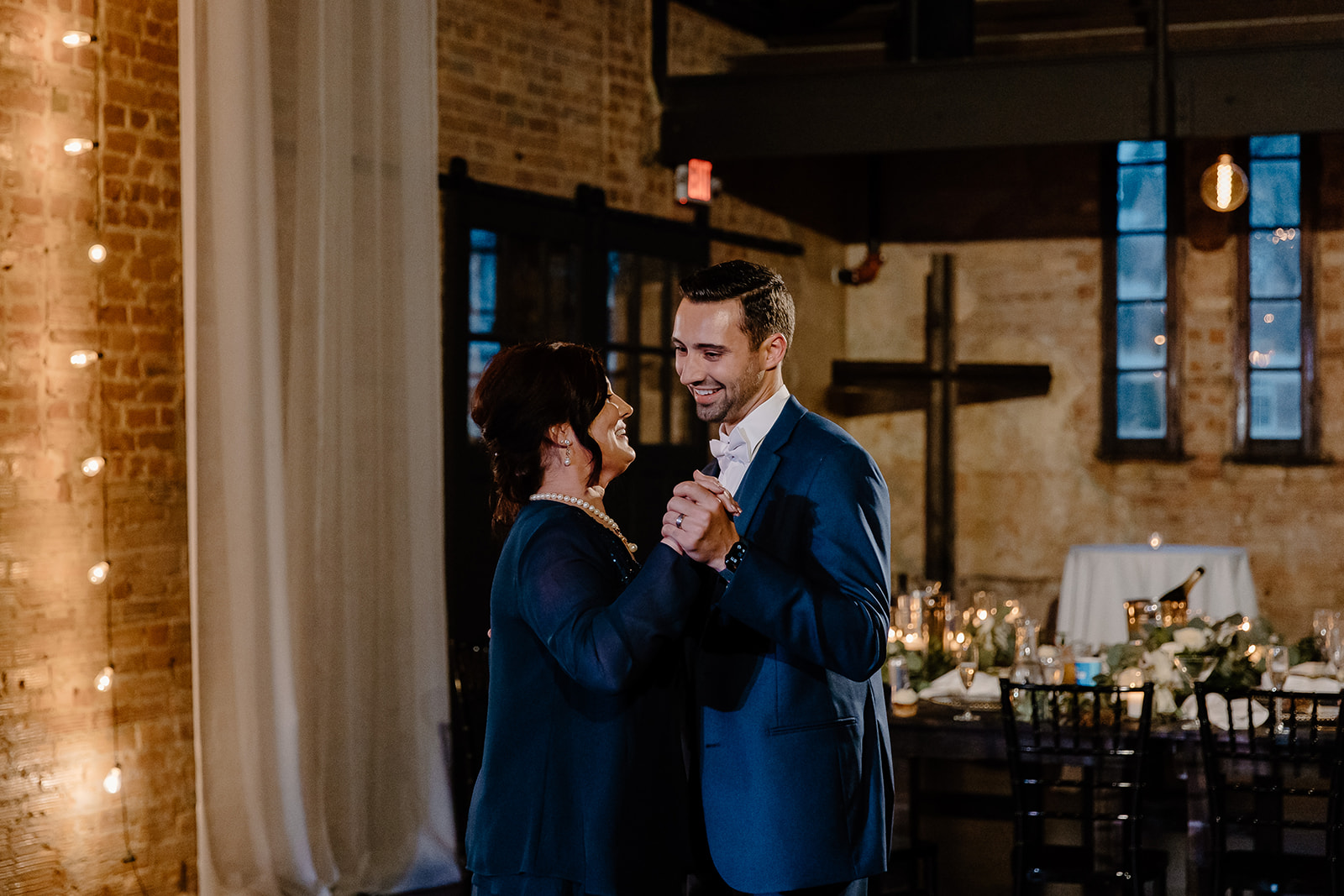 Groom shares his first dance with his mother. 