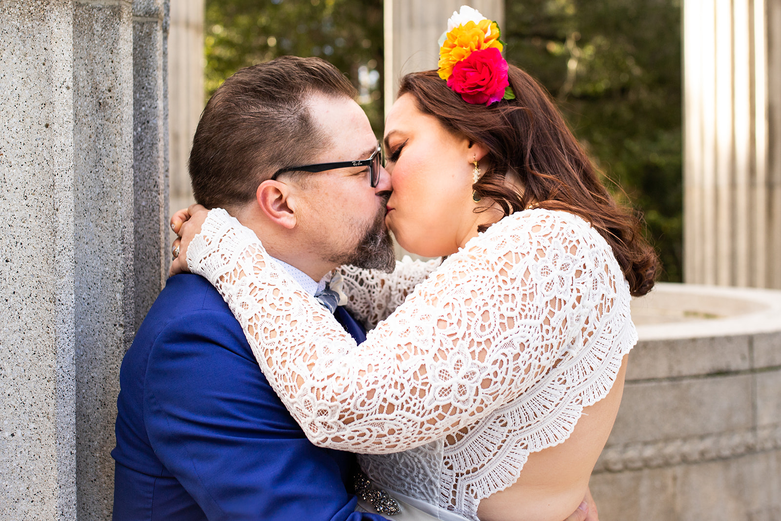 bride and groom kissing floral headband