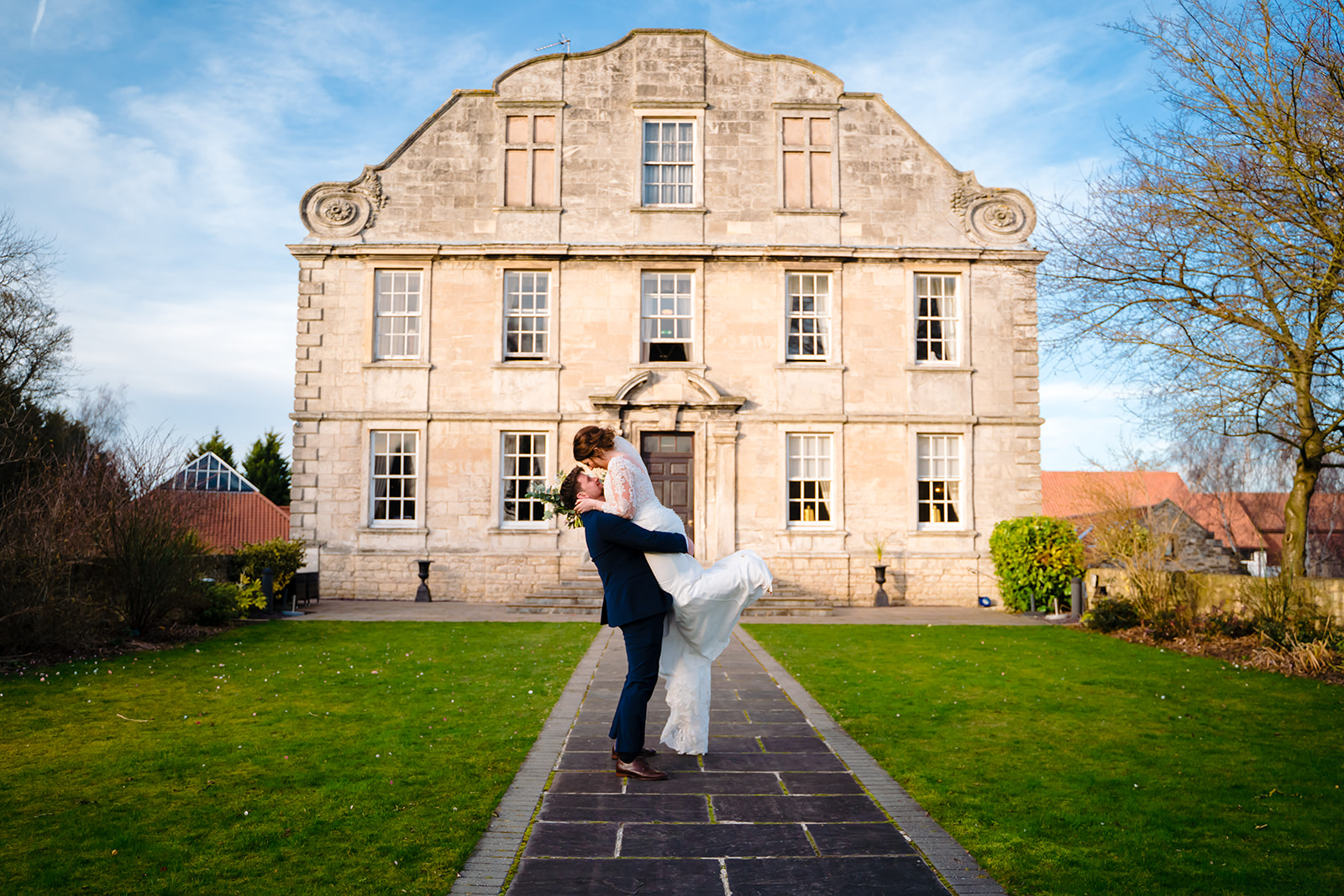 groom lifts bride at a Hellaby Hall Wedding
