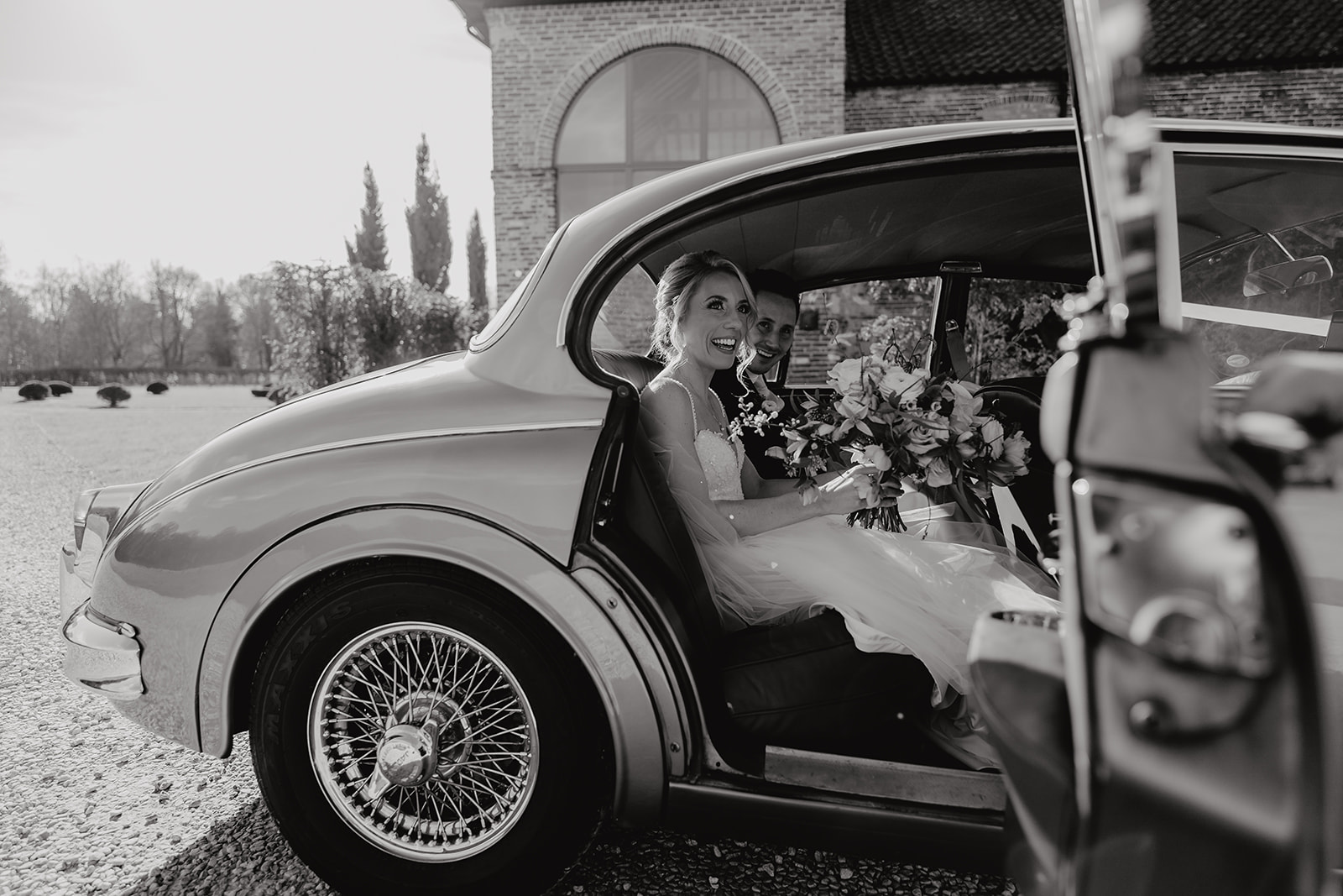 The Bride arrives in a vintage wedding car