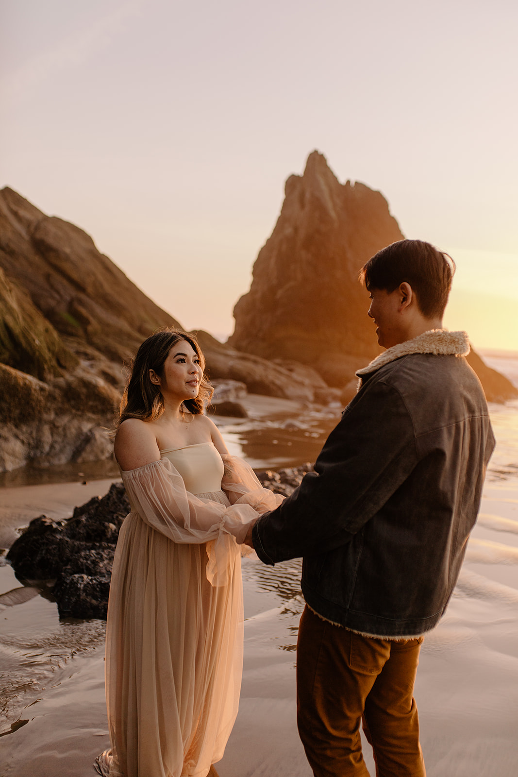 Dreamy golden hour maternity session during sunset at Hug Point along the Oregon Coast