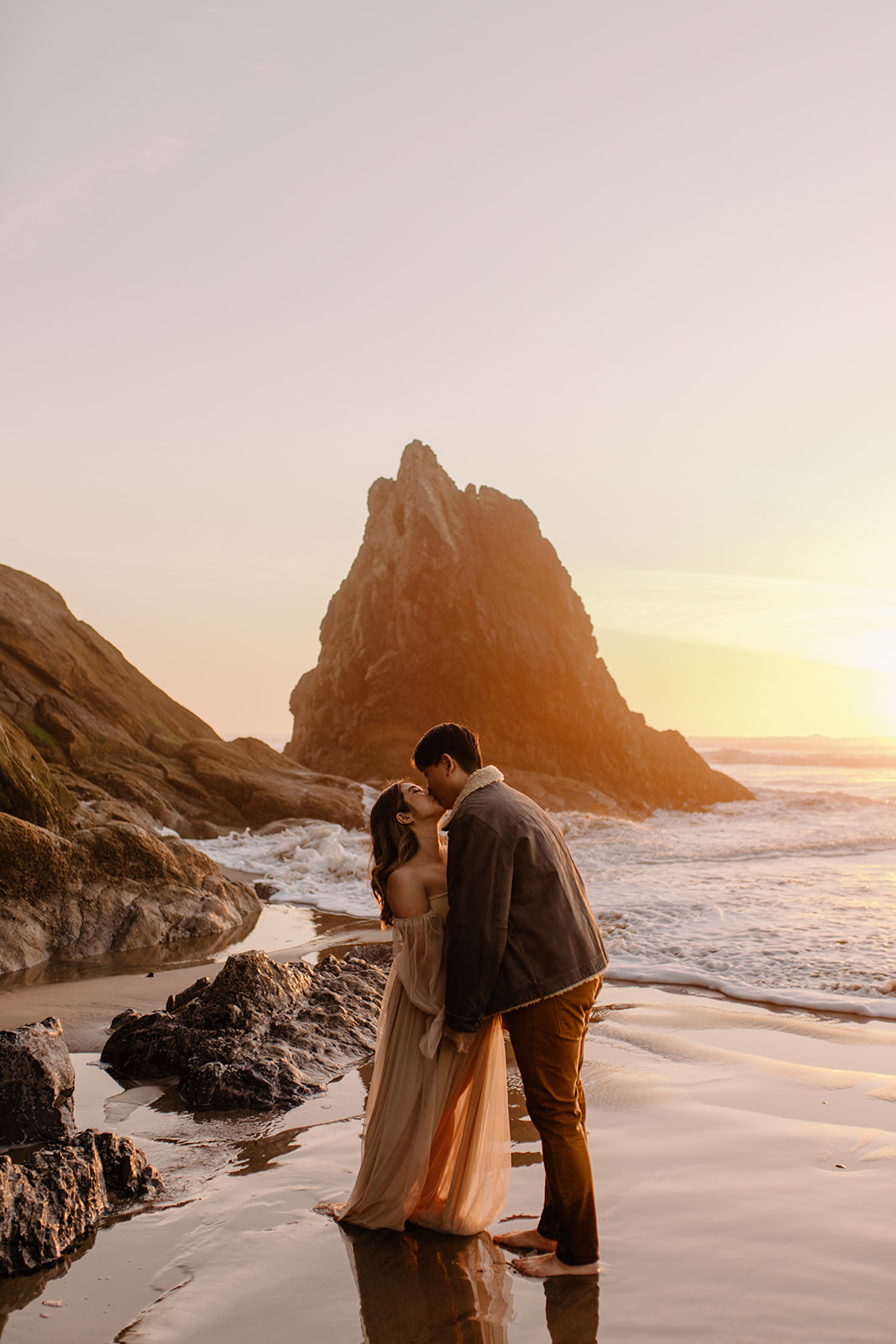 Dreamy golden hour maternity session during sunset at Hug Point along the Oregon Coast
