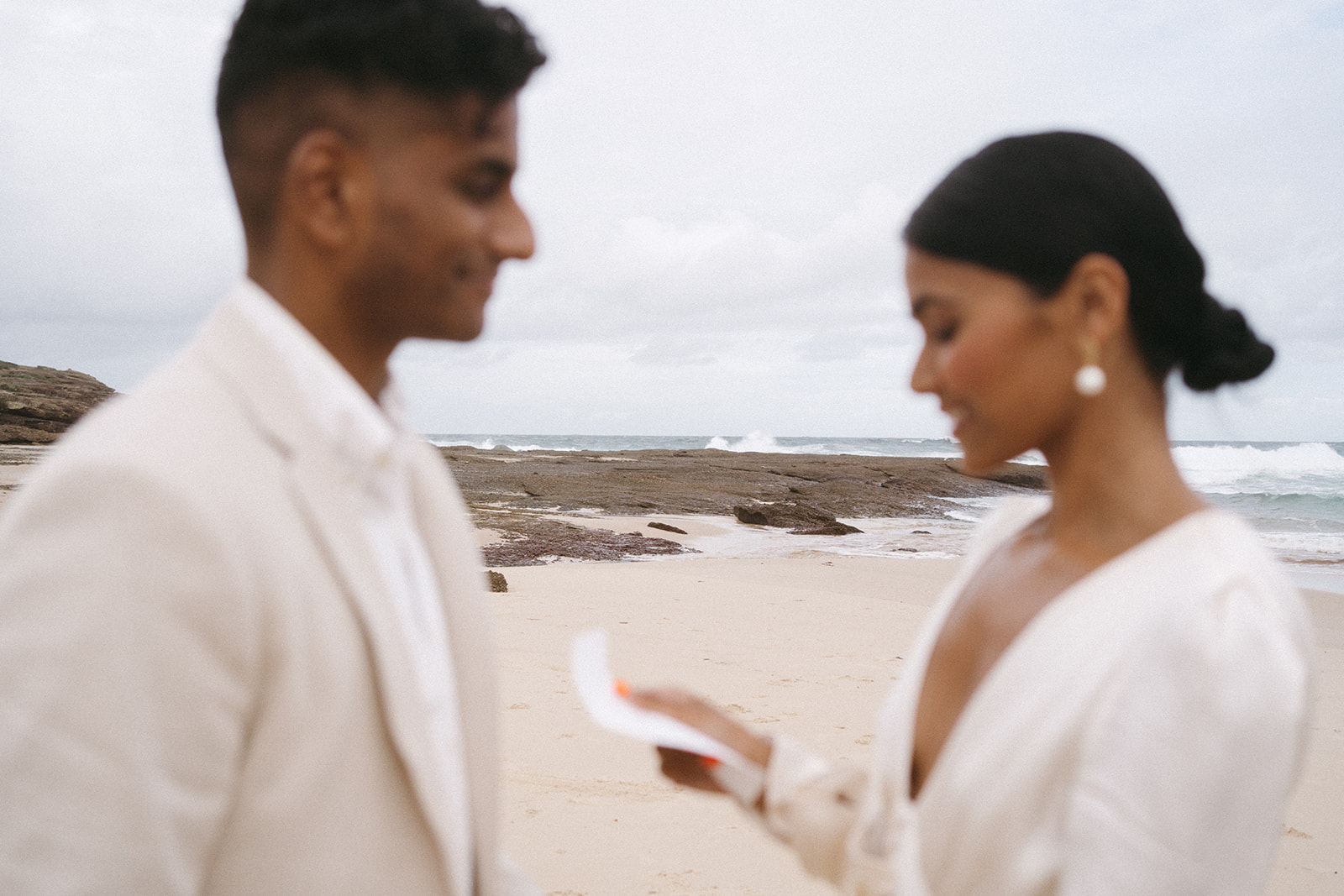 Dramatic wedding elopement on beach | Destination wedding photographer