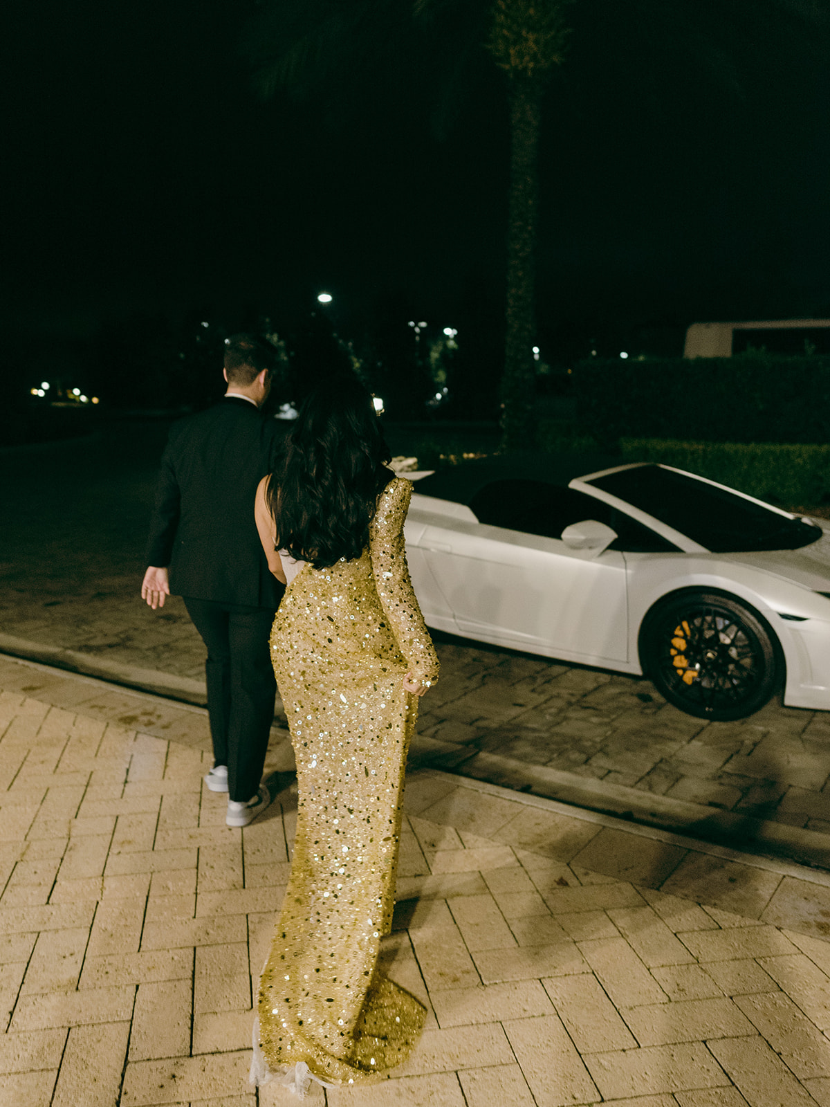 The bride and groom make their getaway in their white Lamborghini at the Four Seasons Orlando Resort