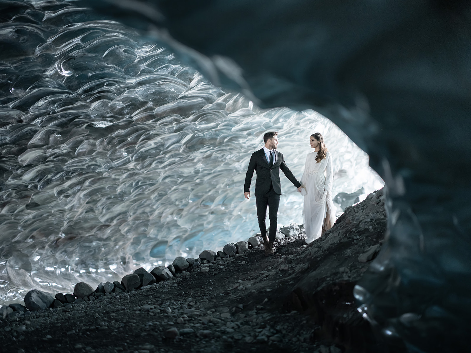 Bride and Groom exploring an Ice Cave during their Iceland Elopement.