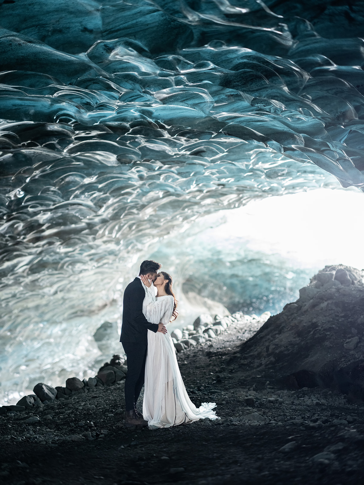 Bride and Groom embrace in an ice cave during their Iceland Elopement. 