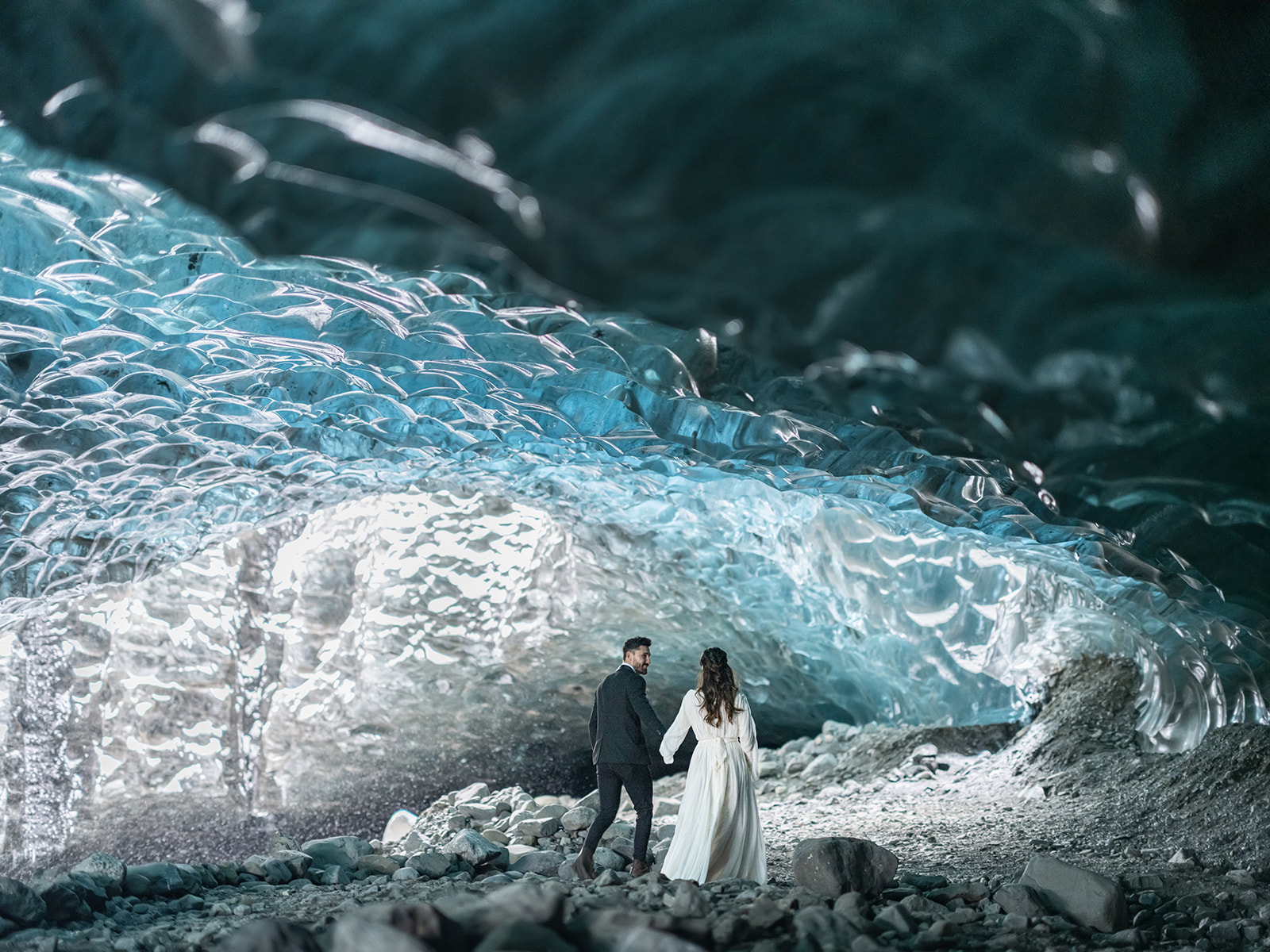 Bride and groom exploring and Ice Cave during their Iceland Elopement.