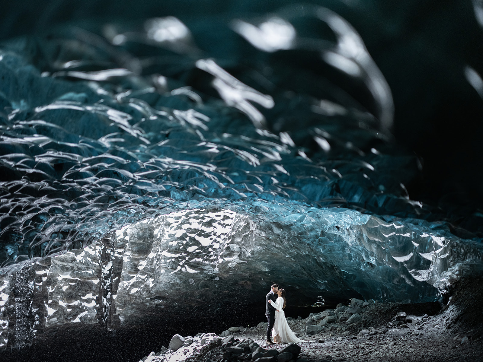 Bride and groom eloping in an Ice cave in Iceland. 