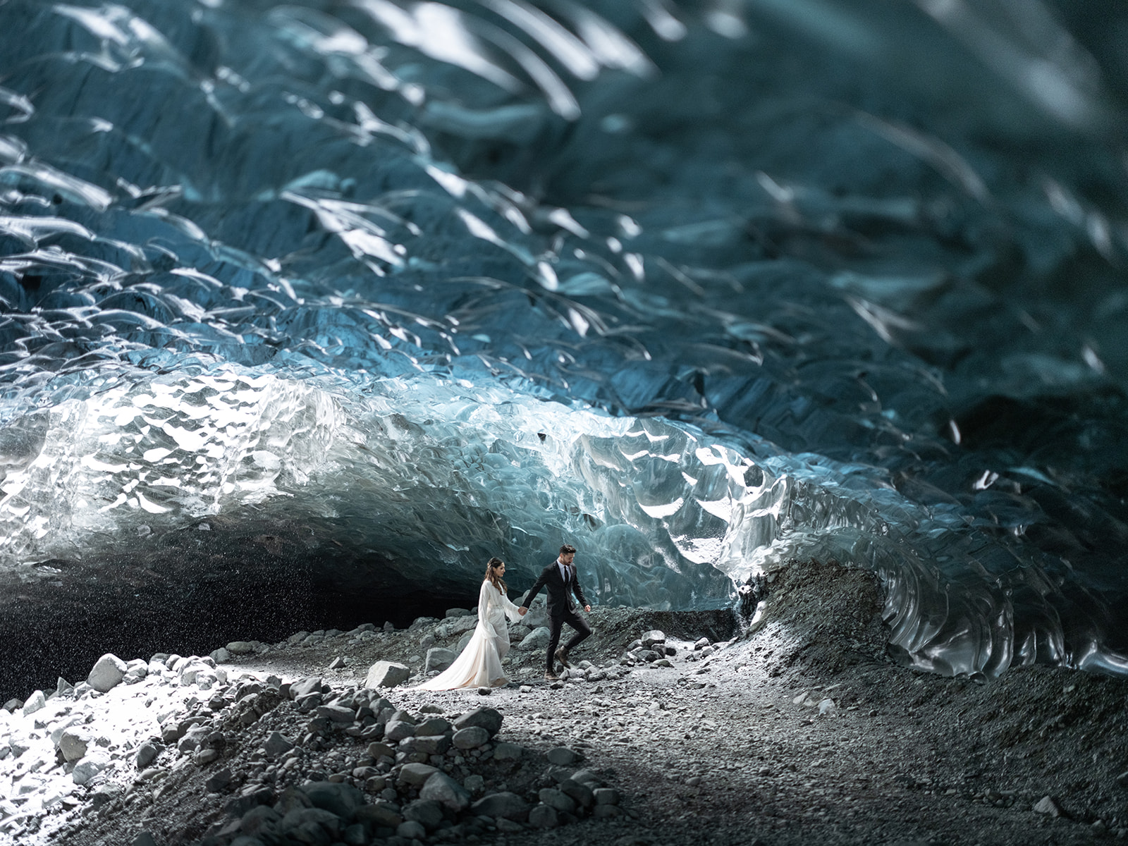 Bride and groom kissing in an Ice Cave on their Elopement day in Iceland.