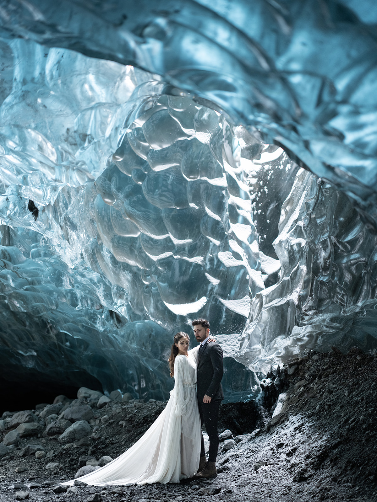 Bride and groom kissing in an Ice Cave on their Elopement day in Iceland.