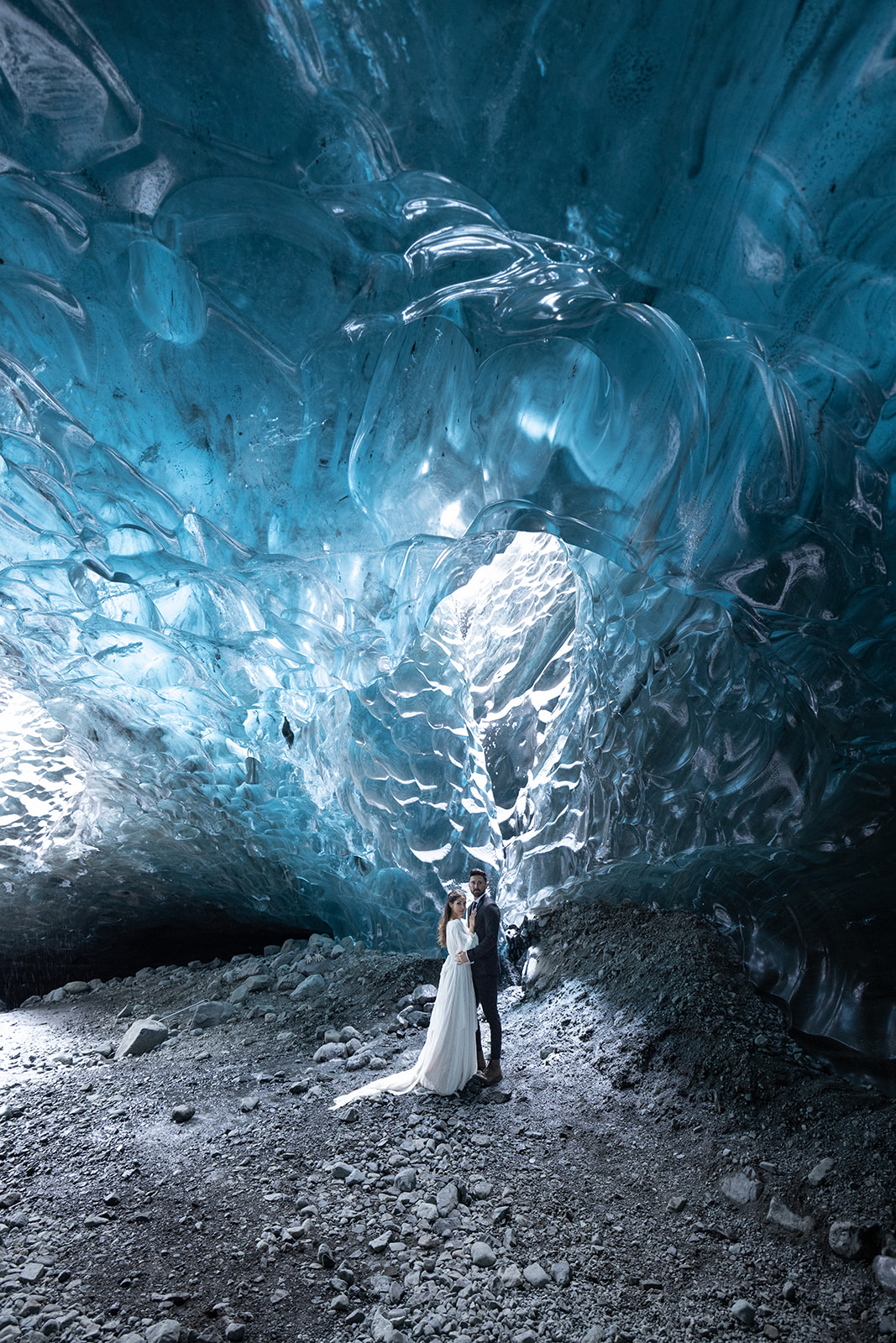 bride and groom kissing in an Ice Cave during their Elopement in Iceland. 