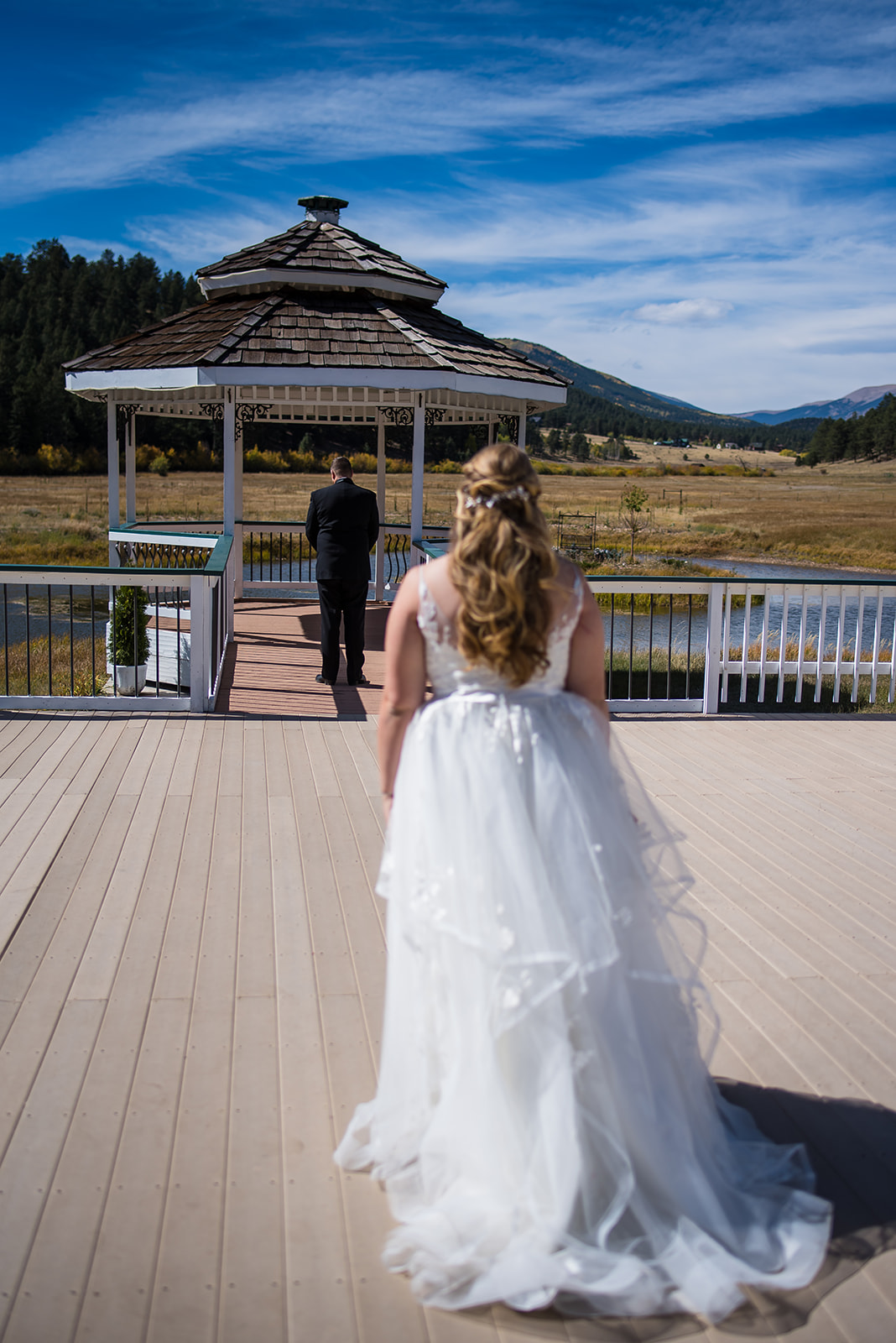 a bride walks up to her groom at their Deer Creek Valley Ranch wedding