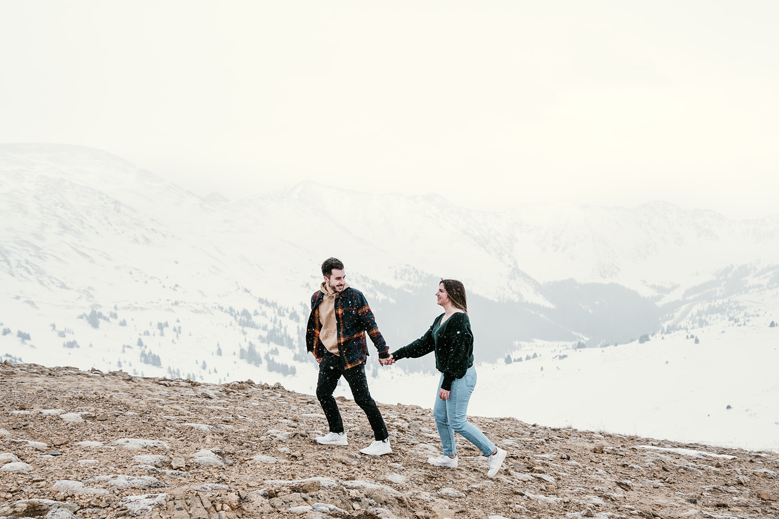 romantic mountaintop snowy engagement session in Dillon, Colorado