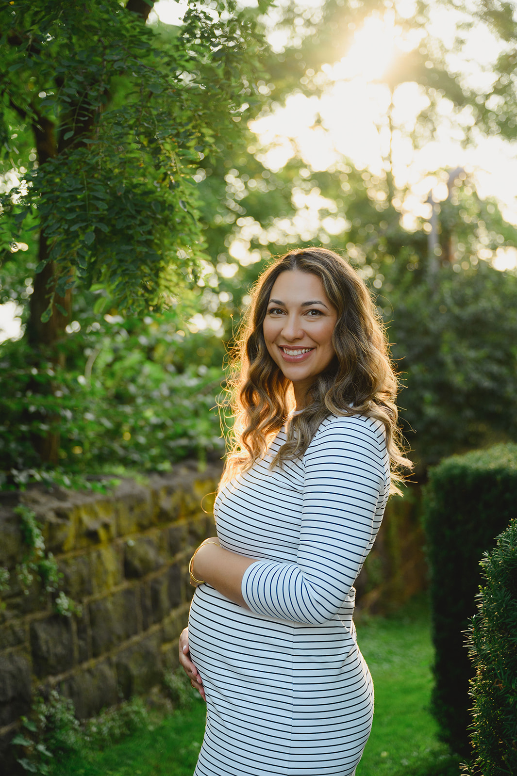 Maternity Photos of a gorgeous backlit lit mom to be 