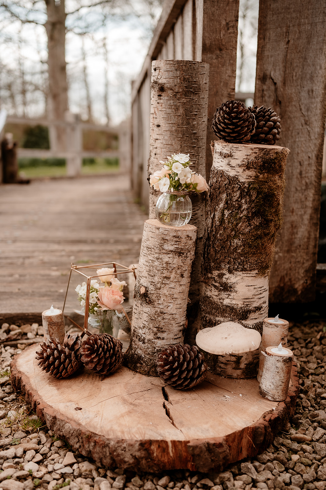 Birchwood and peach flower styling on the bridge with tealight candles