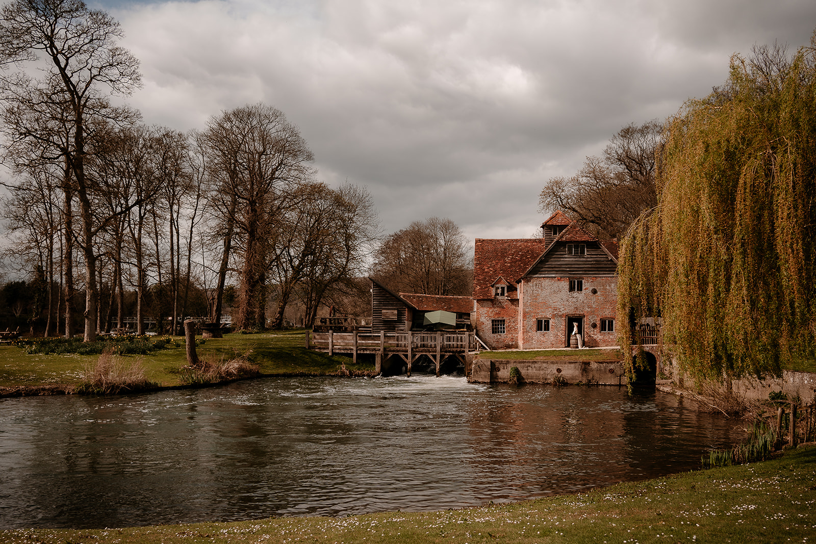 Mapledurham House wedding venue - views across the water to the mill. 