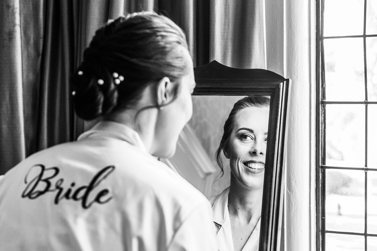 A bride looking in the mirror