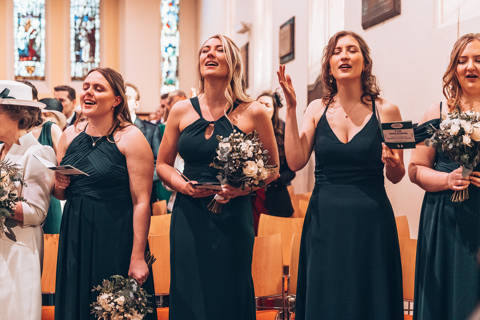 Bridesmaid singing during a church wedding