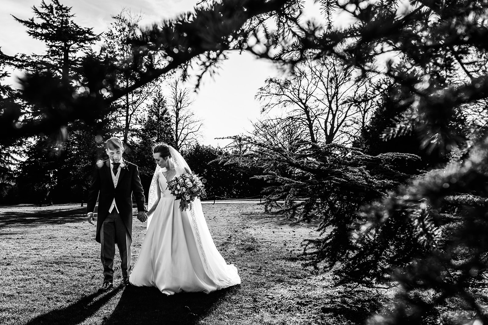 A couple walking around the grounds at Hanbury Manor