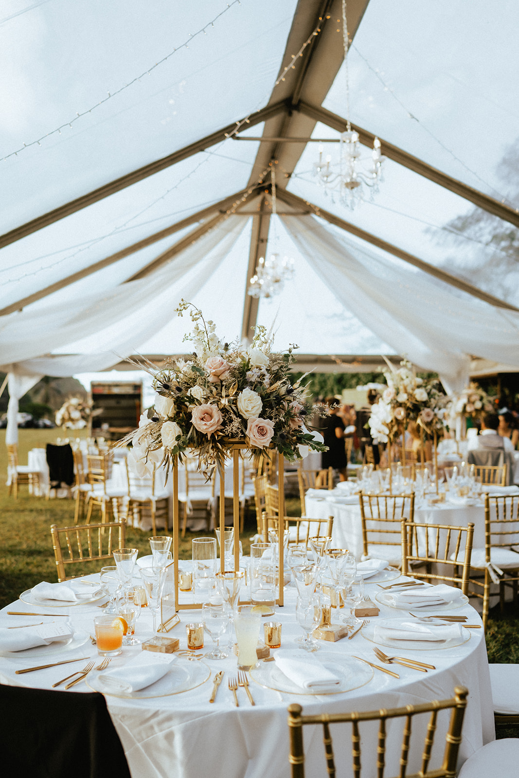 Elegant wedding reception details in Kualoa Ranch's Low Camp