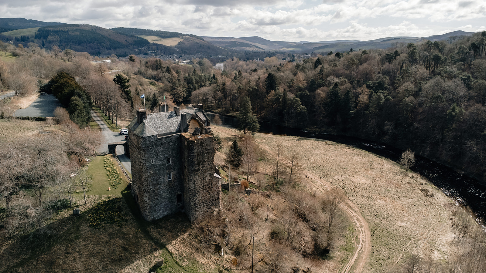 A drone photo of Neidpath Castle overlooking Peebles.