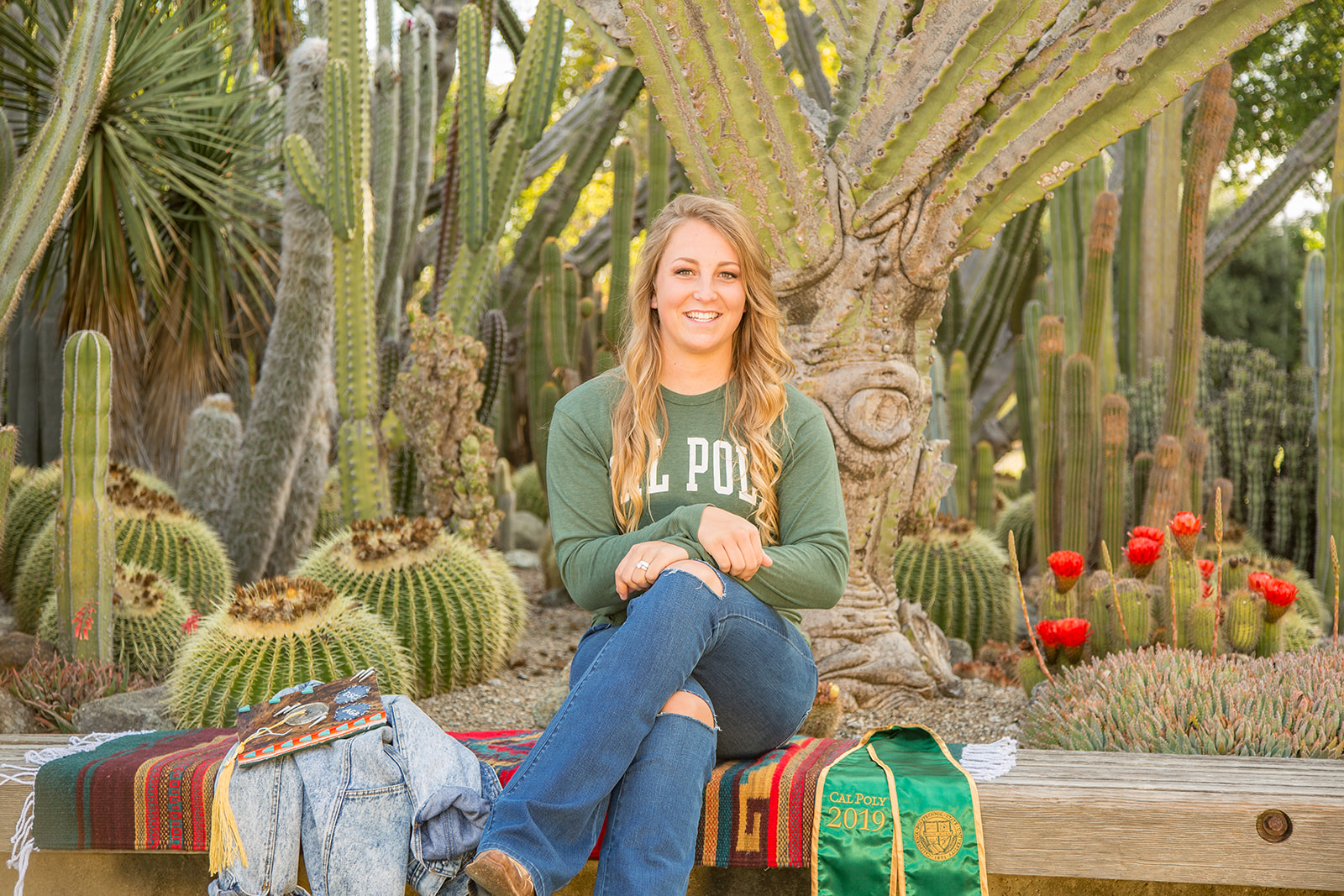 Senior photos at cal poly cactus garden with props