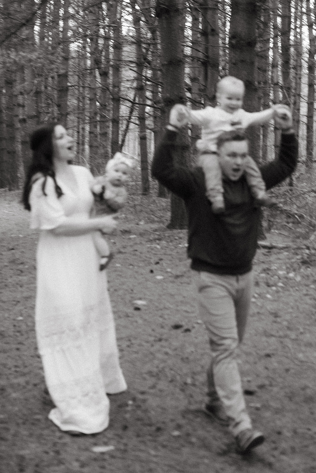 Candid family photography in Lowville pine tree forest