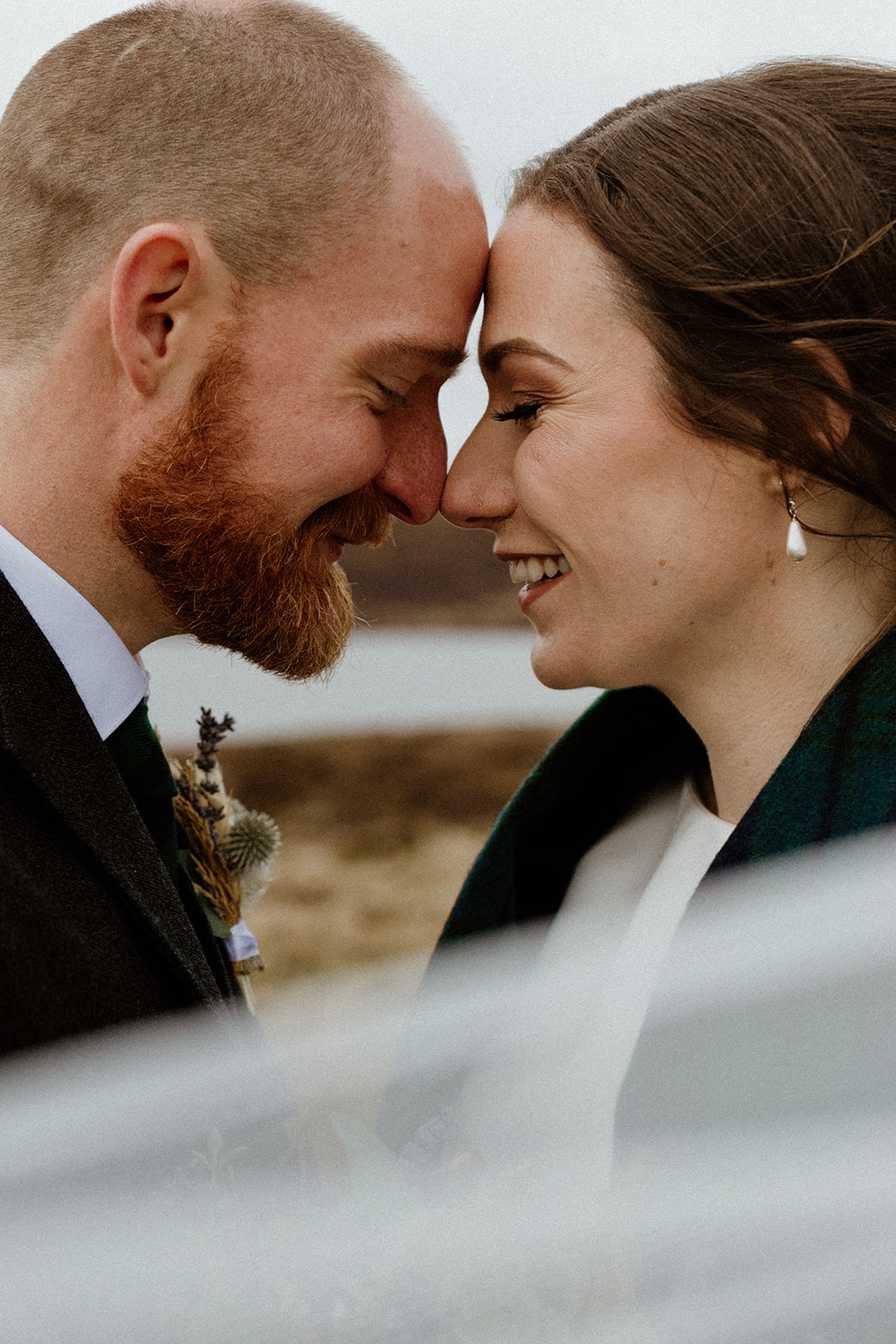 An intimate moment after the meaningful ceremony for the bridal couple as they celebrate their wedding in Shetland.