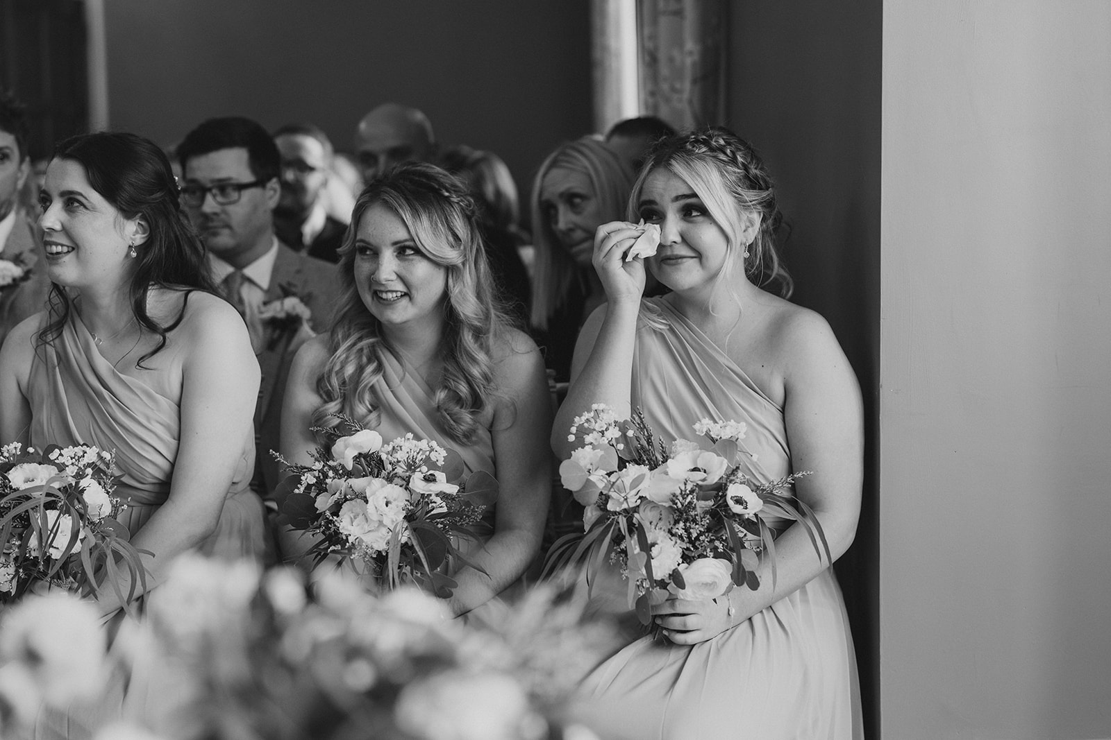 A bridesmaid getting emotional during the wedding ceremony