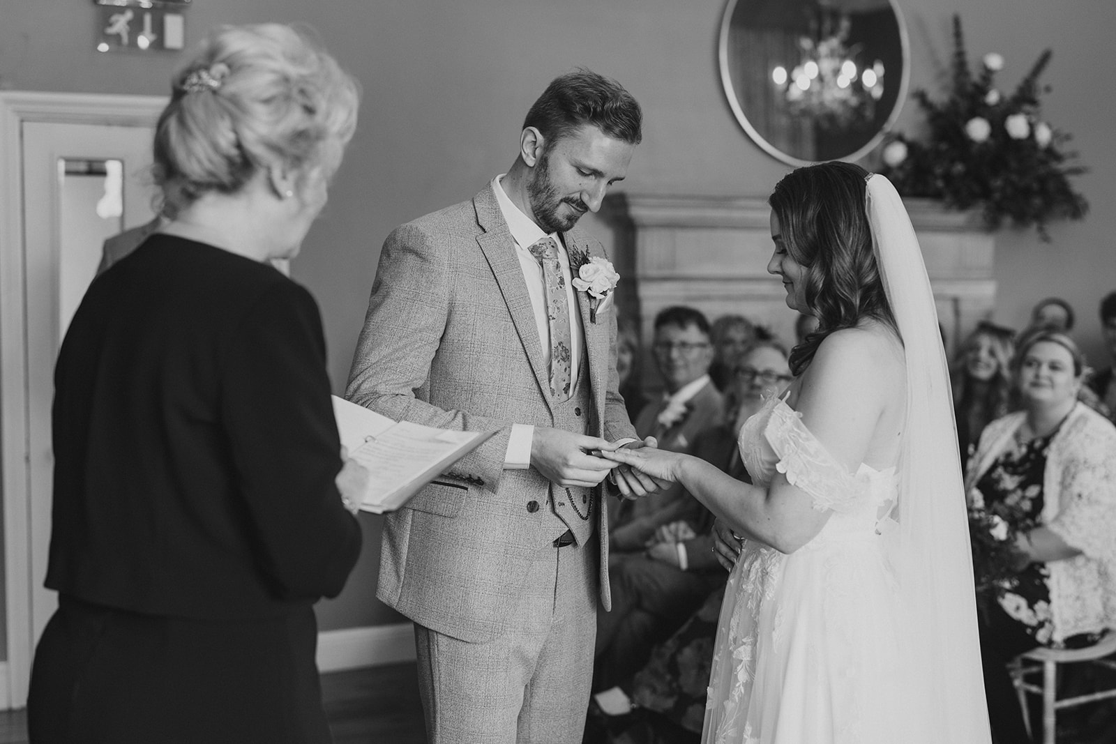 Hodsock Priory Wedding Photography - the bride and groom, exchanging wedding rings
