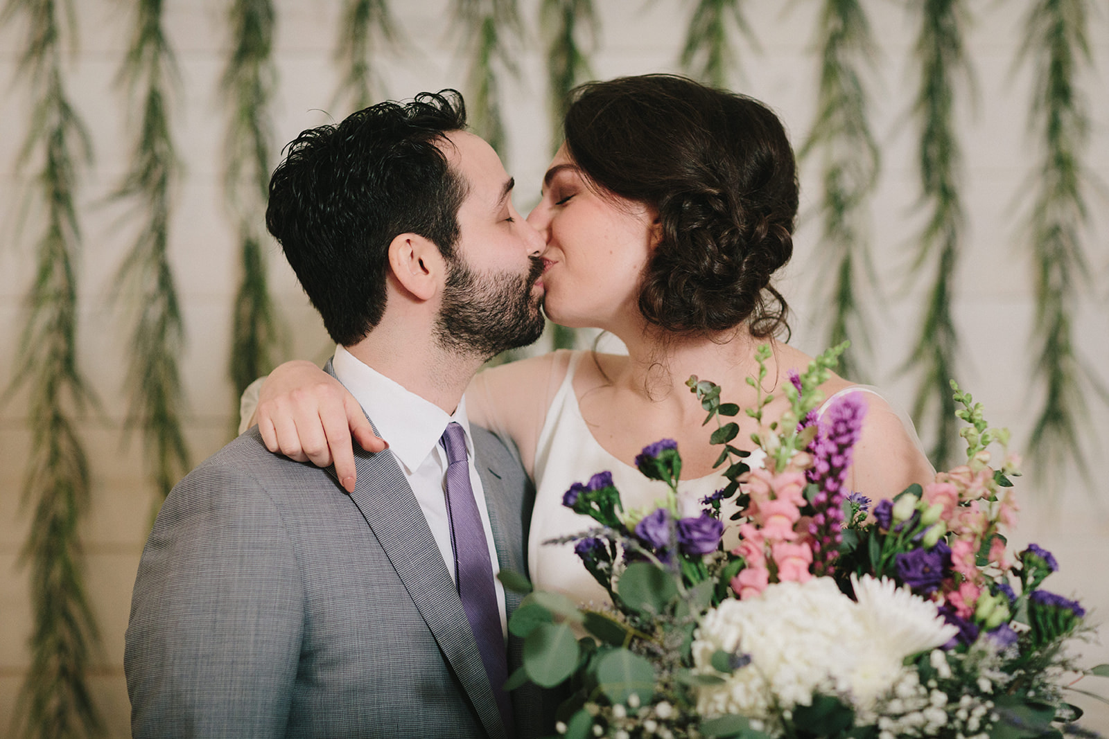 Couple kisses on their wedding day at Hudson Farms