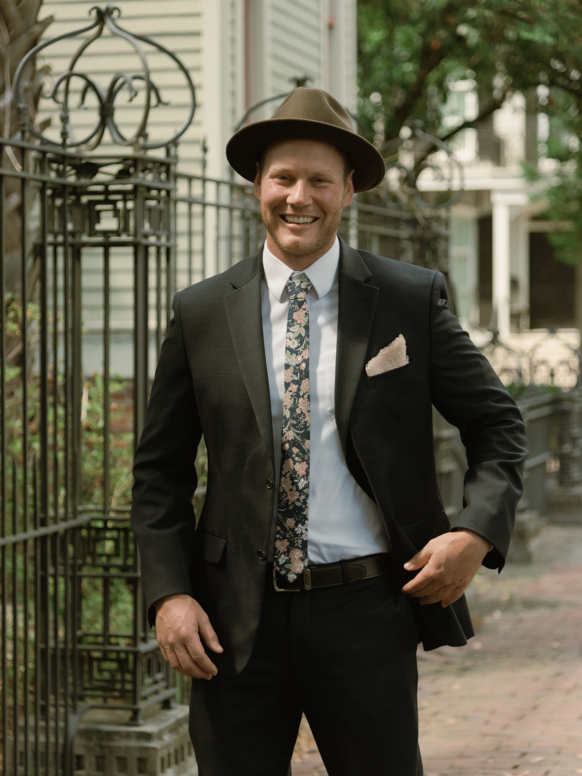 The groom wore a navy blue suit and fedora in a nod to classic Southern style for this elopement in Savannah, Georgia 
