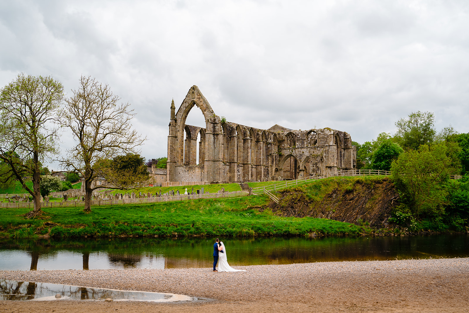 Couple in front of bolton abbey
